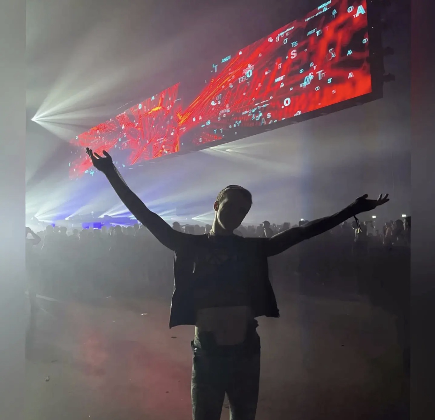 Lloyd at a festival under the lighting rig